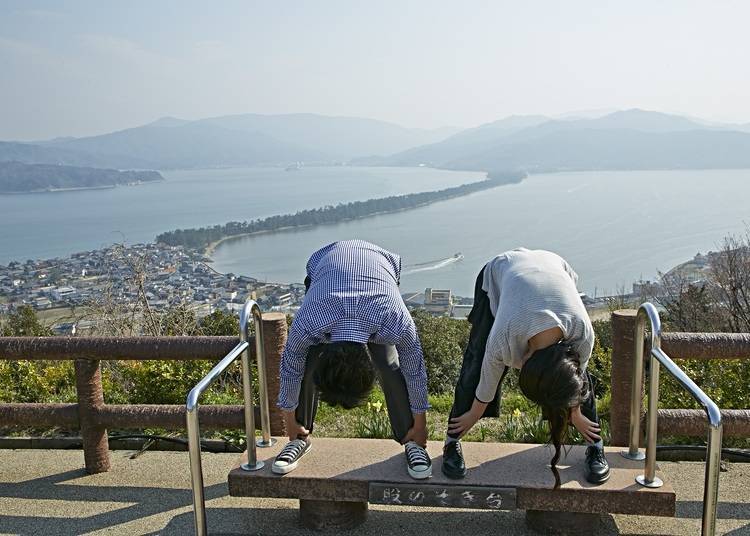 By peeking at the sandbank from between one's thighs, Amanohashidate appears like a soaring dragon, and this popular way of viewing the scene is aptly named shōryūkan, meaning "soaring dragon view"