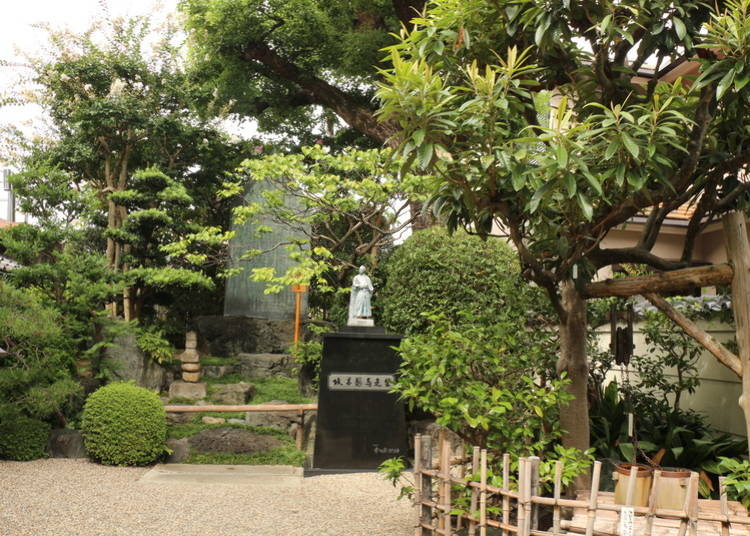 Statue of Ryoma Sakamoto standing in the garden