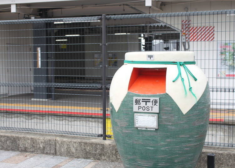 A teapot-shaped mailbox outside JR Uji Station's South Exit