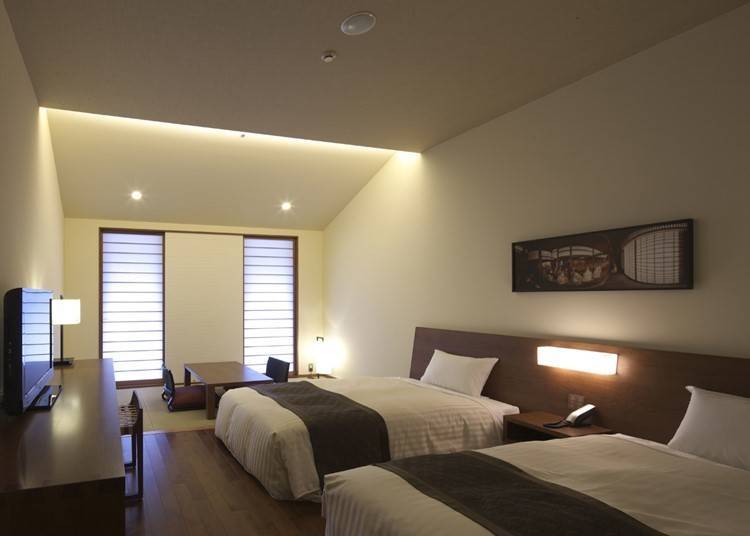 "Deluxe Japanese-Western Room" where hardwood flooring and tatami mats coexist