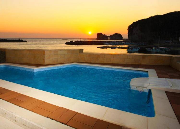 A spectacular view of the sunset from the private pool. (Image: Booking.com)