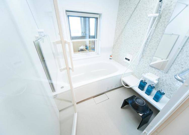 The bathroom features a clean-looking all-white interior.  (Image: Booking.com)