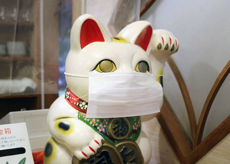 Protecting the restaurant’s resident maneki-neko!