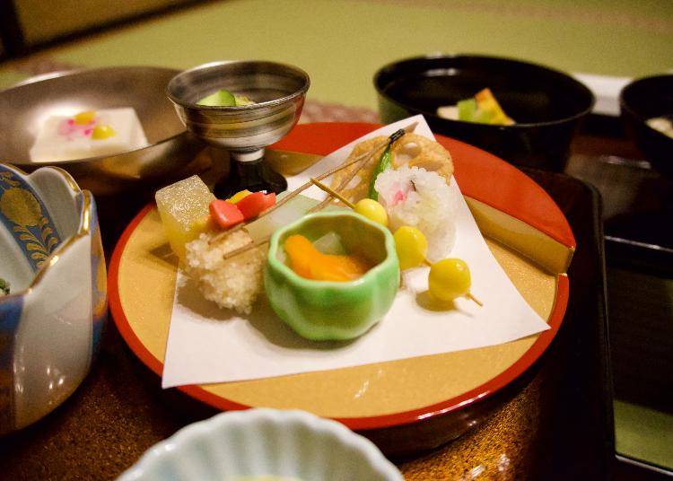One plate of many! This dish had persimmon, lotus root, a vegetable maki roll, and beans