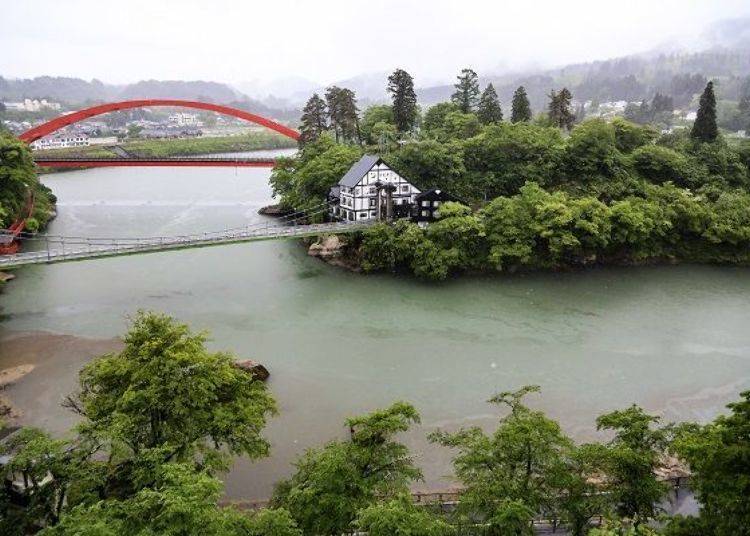 Tadami River has 2 red arched bridges across it (the bridge in the foreground is the Zuikōji-bashi bridge)