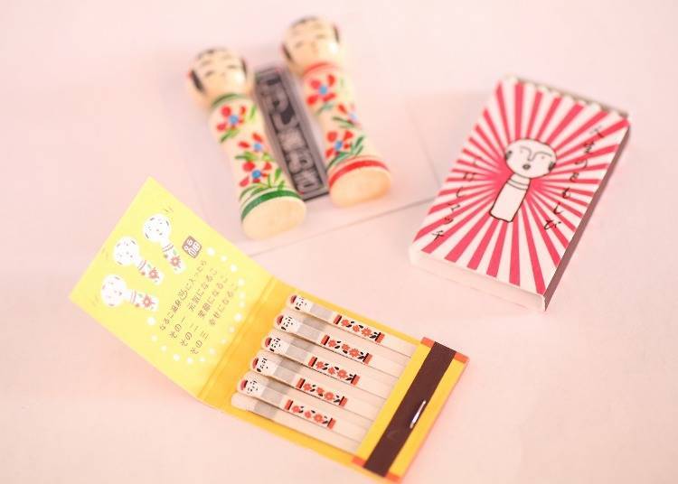 Front: Naruko matchsticks (220 yen, without tax); Right: Kokeshi matchsticks (180 yen, without tax); Back: Kokeshi chopstick holders (250 yen each, without tax)
