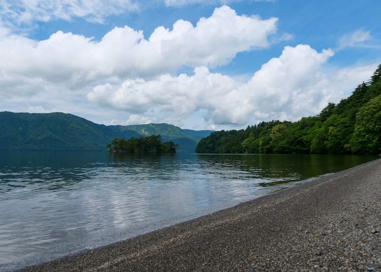 A calming lakeside breeze cools you as you walk