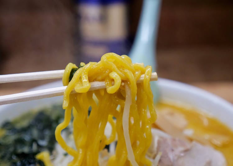 The thick and curly noodles complement the soup
