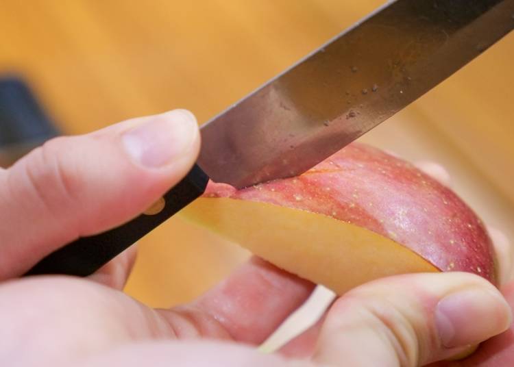 Make a cut using the base of the knife blade