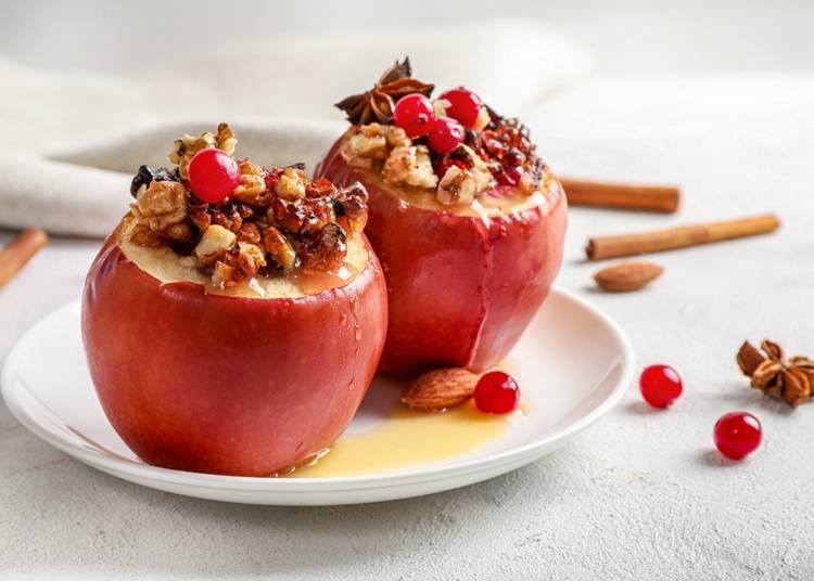 Delicious baked apples with cinnamon and nuts