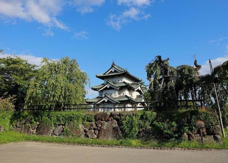 Hirosaki Castle Tower under a clear, blue sky