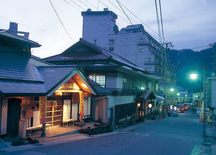 Enjoy a stroll up a sloping street—leading from the station to the hot spring resort area.