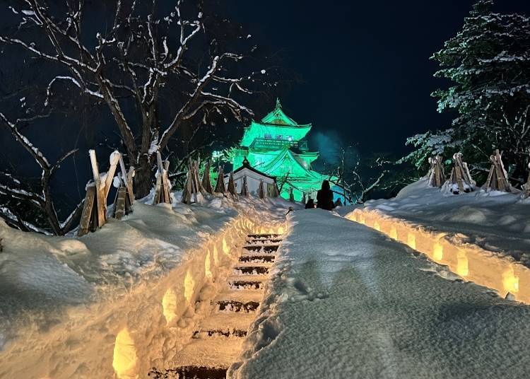 Enchanting staircase of snow leads to the illuminated castle