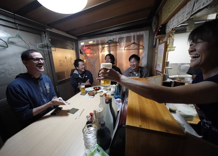 Customers enjoy a beer and a joke in Tsukuriya