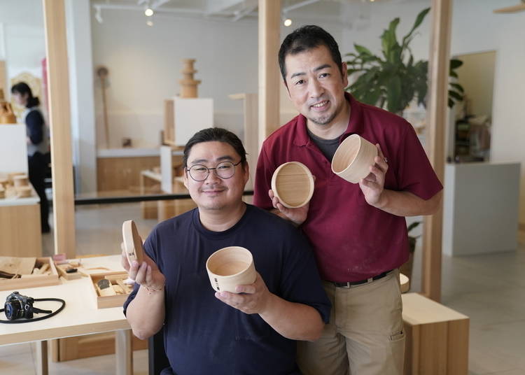 Yoshimasa Shibata (right) and a student show off their finished articles