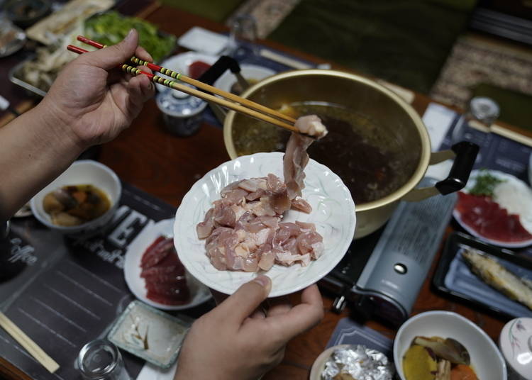 Preparing hinai-jidori to be served with kiritanpo