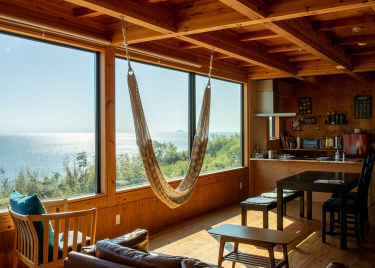 The living room, dining room, and kitchen share a large open space