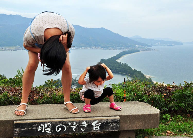 Many Japanese believe Amanohashidate is best viewed upside down