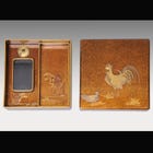 An inkstone case with cock-design raised lacquer work on aventurine lacquer (made in late Edo period)