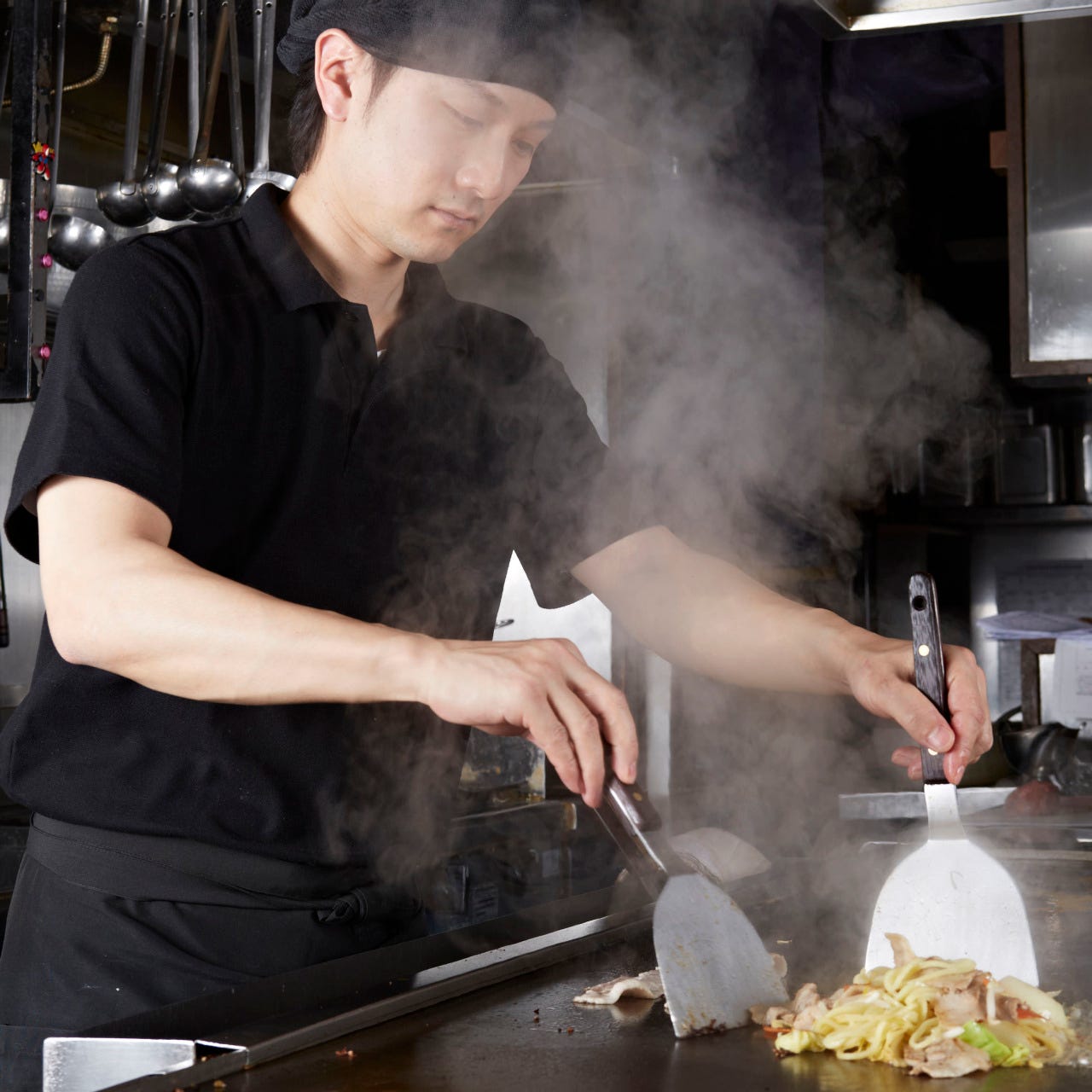 Okonomiyaki is baked by craftsmen