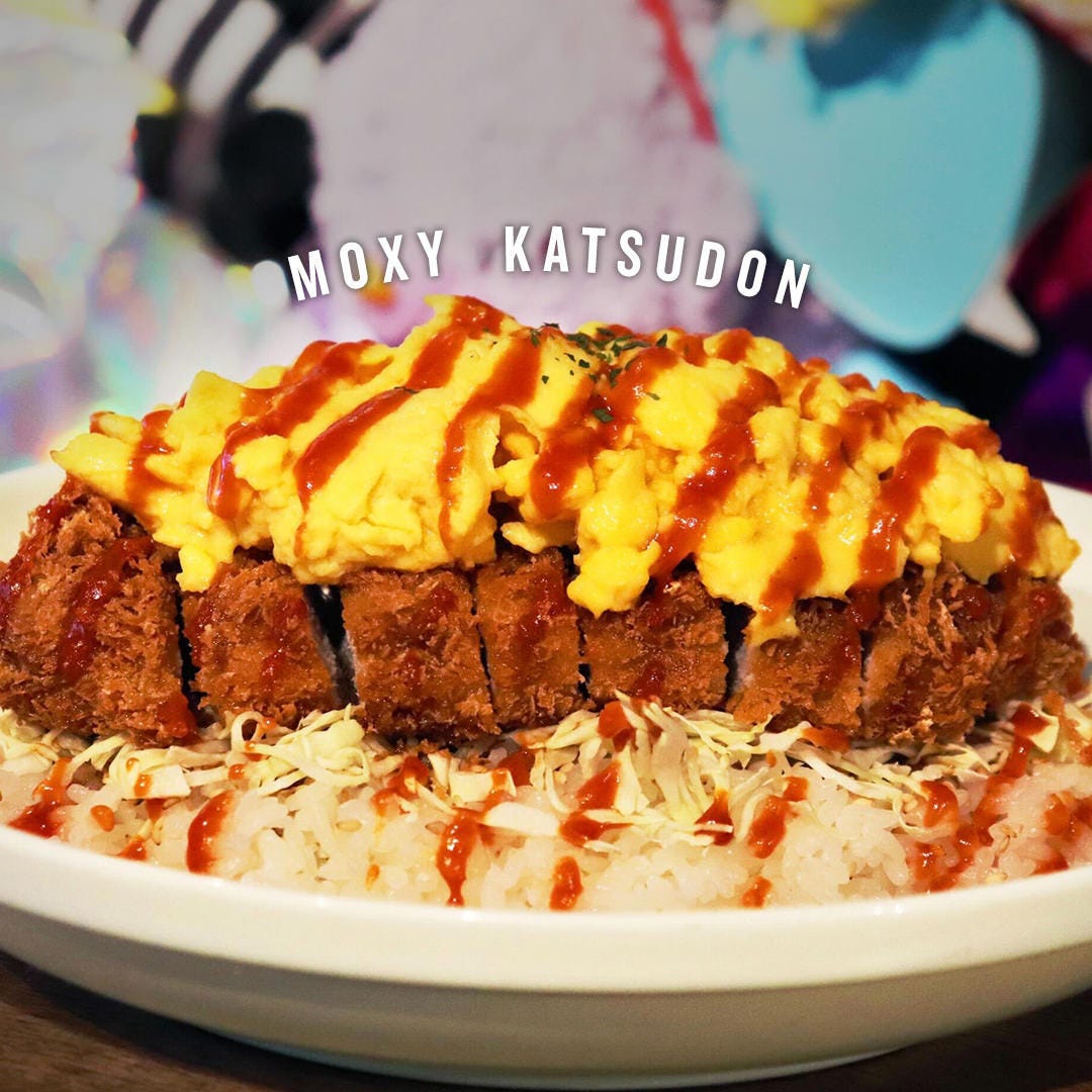 キャベツにとんかつ、卵をのせた名物ランチ